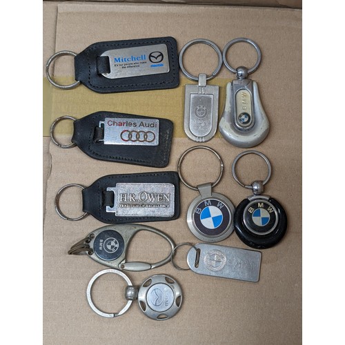 89 - 10 x assorted car manufacturer keyrings including BMW, Mazda and Audi