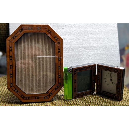 23 - Approximately 18 x 13.5 cm high glass marquetry look freestanding picture frame and similar mini fol... 