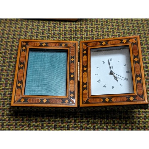 23 - Approximately 18 x 13.5 cm high glass marquetry look freestanding picture frame and similar mini fol... 