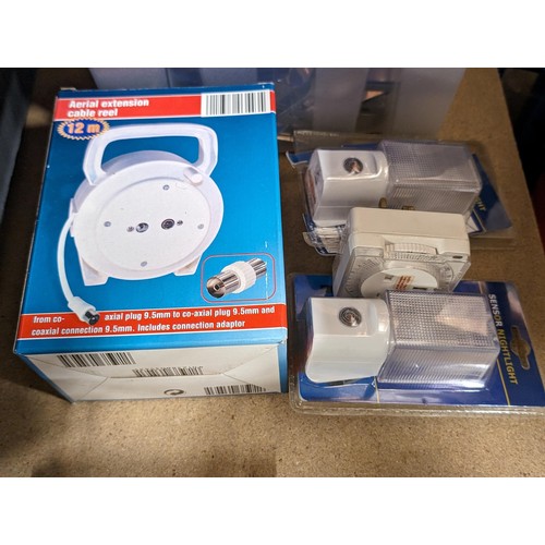 136 - Boxed and unused 12 metre aerial extension cable reel, 2 x boxed sensor night lights and unboxed plu... 