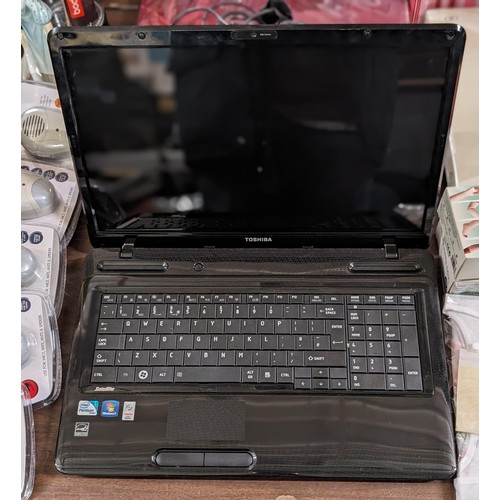 167 - Toshiba Satellite retro laptop with original; charger - password protected so needs factory reset