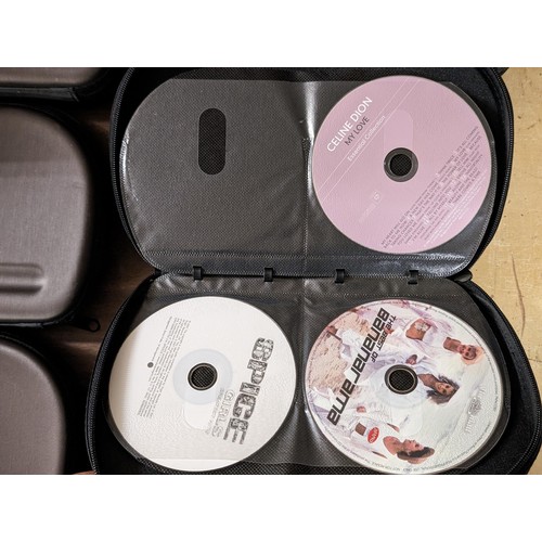 209 - 9 x Pro-X CD/DVD cases full and part full with assorted Daily Mail and Express CDs and DVDs