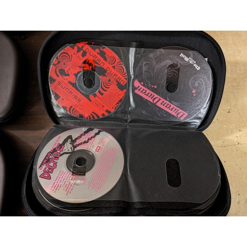 209 - 9 x Pro-X CD/DVD cases full and part full with assorted Daily Mail and Express CDs and DVDs