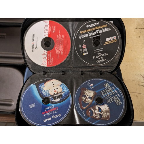 209 - 9 x Pro-X CD/DVD cases full and part full with assorted Daily Mail and Express CDs and DVDs