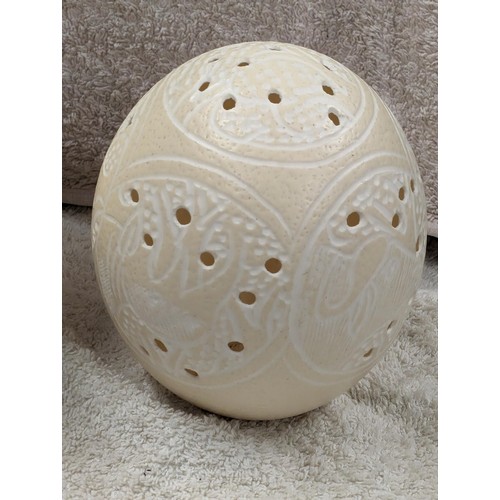 20 - Carved ostrich egg with African tribal detail etc