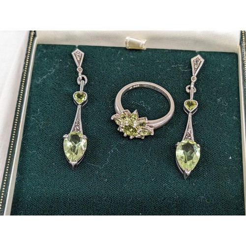 458 - 925 stamped silver and peridot dangling earrings and similar ring