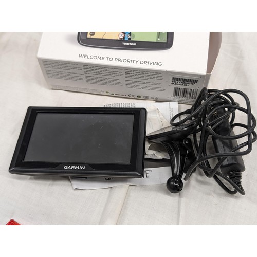 219 - Garmin sat nav with in car charger and window suction holder - in wrong box