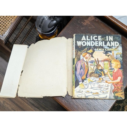 77 - Vintage Alices adventures in Wonderland book with dust jacket in good condition