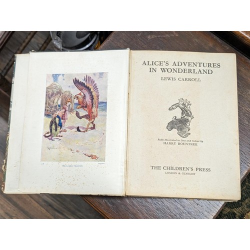 77 - Vintage Alices adventures in Wonderland book with dust jacket in good condition