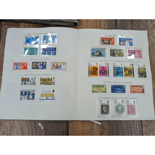 263 - QEII stamp album - complete and large photo album containing assorted UK stamps