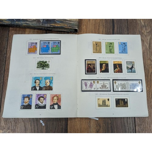 263 - QEII stamp album - complete and large photo album containing assorted UK stamps