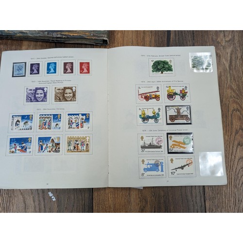 263 - QEII stamp album - complete and large photo album containing assorted UK stamps