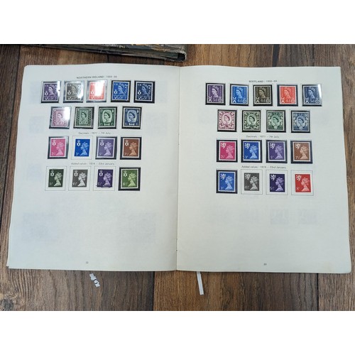 263 - QEII stamp album - complete and large photo album containing assorted UK stamps