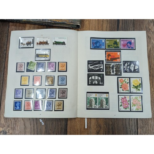 263 - QEII stamp album - complete and large photo album containing assorted UK stamps