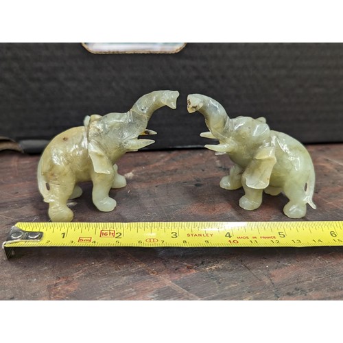 86 - Pair of green jade elephants - 1 with end of tail missing and the other with part of ear and end of ... 