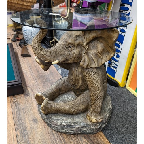 348 - 50 cm tall glass topped composite elephant side table