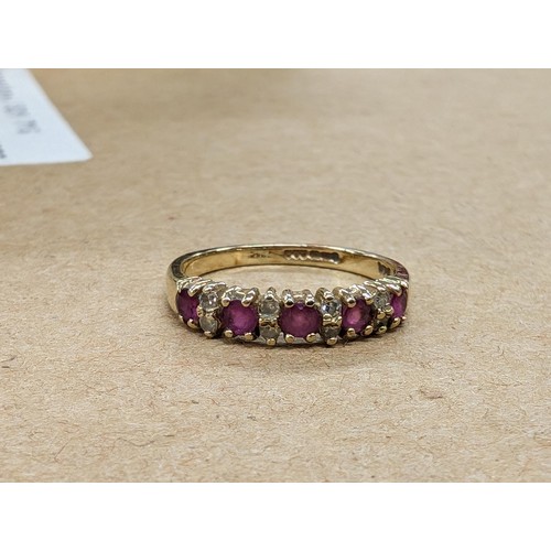 486 - 375 hallmarked 9 carat gold garnet and diamond dress ring size J - 1.4 gm - all proceeds from this l... 