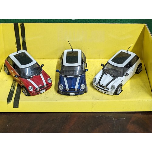 60 - Corgi trio of modern Mini die cast Italian Job cars