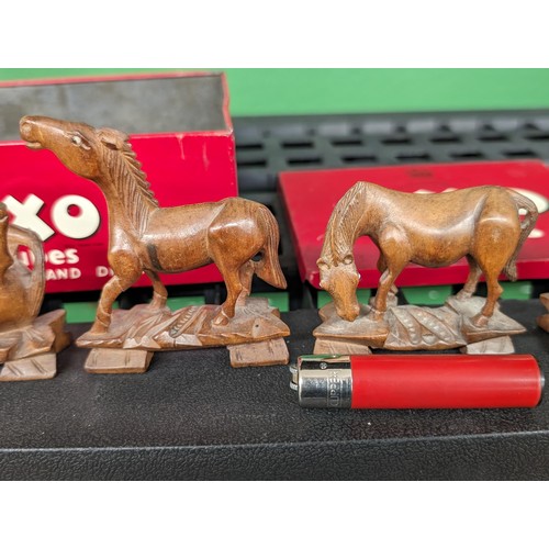 13 - 6 x hand carved small wooden horses with glass eyes in old OXO tin