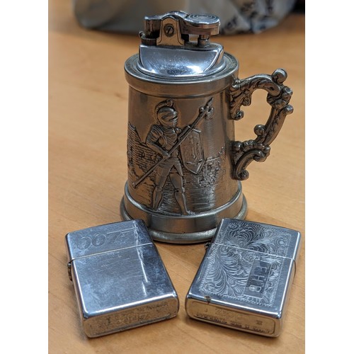 229 - 2 x Zippo petrol lighters and novelty medieval stein table lighter