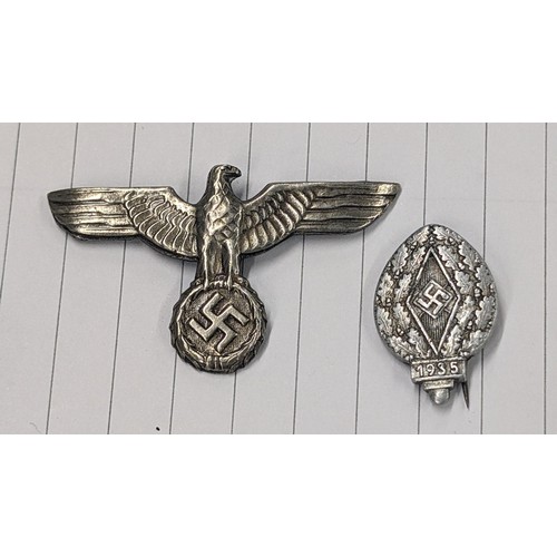 194 - WWII German eagle cap badge and 1935 Hitler Youth badge