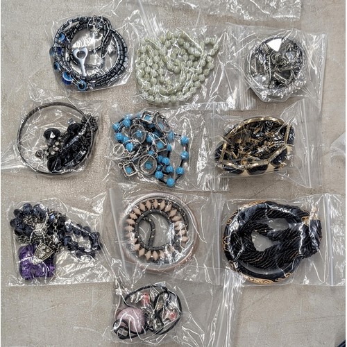 238 - 10 x as new individually bagged dress and costume necklaces and matching or similar bangles or brace... 