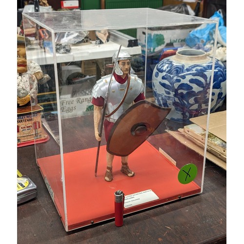 191 - Model of a Roman soldier in 32 x 29 x 39 cm perspex case - was displayed in Doncaster museum