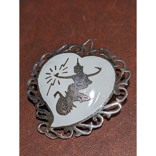 205 - Unusual 5 x 4.5 cm large Siam silver on  white background dancing goddess brooch