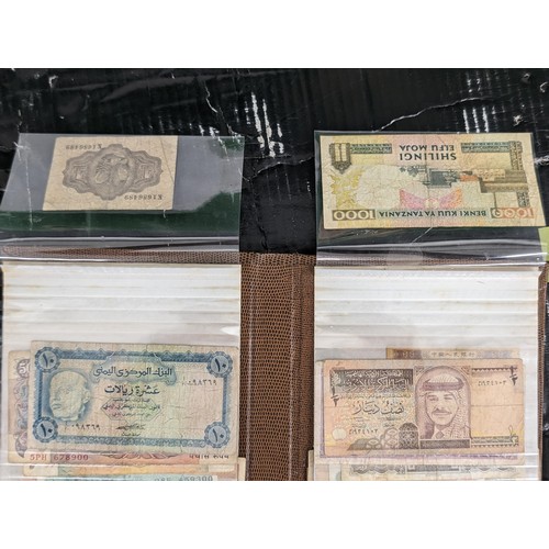 Brown folder with 40 x assorted foreign bank notes