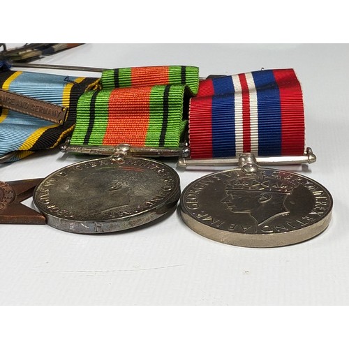 213 - Collection of assorted WWI & II medals plus others and some loose ribbons