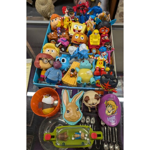 73 - Collection of assorted played with McDonalds plastic happy meal toys including Scooby, Action Man, P... 