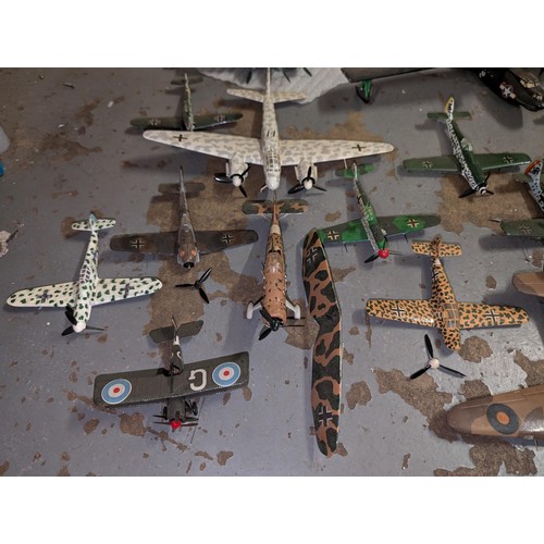 174 - Large collection of assorted military fighters and bombers made and decorated model kit planes, coup... 