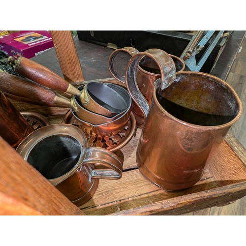 19 - Old wooden tray with handle containing quantity of old copper tankards, jugs and small pan set