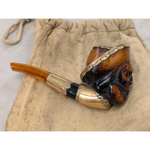 254 - Vintage carved face pipe with amber stem (end broken off) with unstamped yellow metal detailing