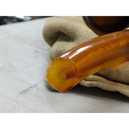 254 - Vintage carved face pipe with amber stem (end broken off) with unstamped yellow metal detailing