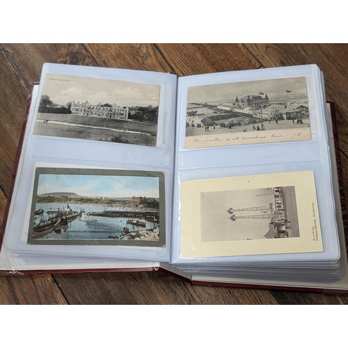 117 - Album with 198 assorted early 1900's onwards vintage postcards including rare Zeppelin, steam trains... 