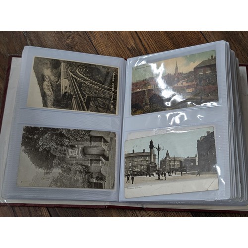 117 - Album with 198 assorted early 1900's onwards vintage postcards including rare Zeppelin, steam trains... 