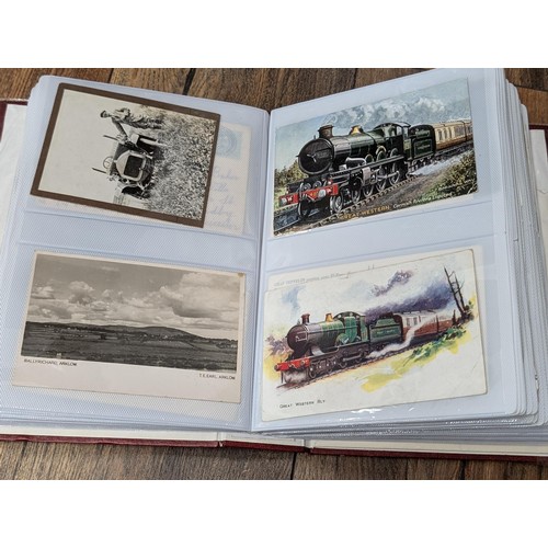 117 - Album with 198 assorted early 1900's onwards vintage postcards including rare Zeppelin, steam trains... 