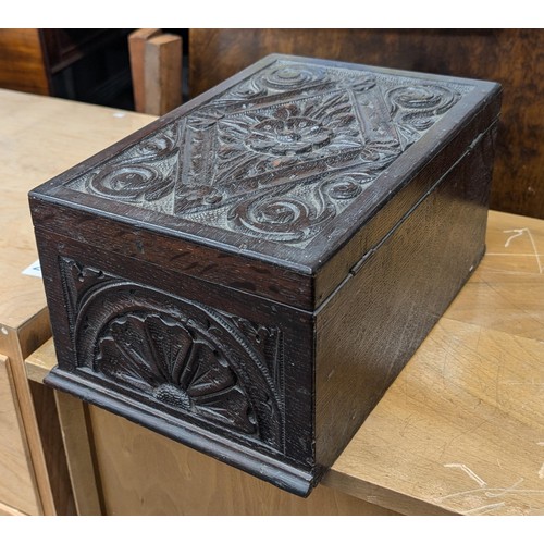 123 - 30.5 x 20 x 15 cm deeply carved Tudor Rose top oak box