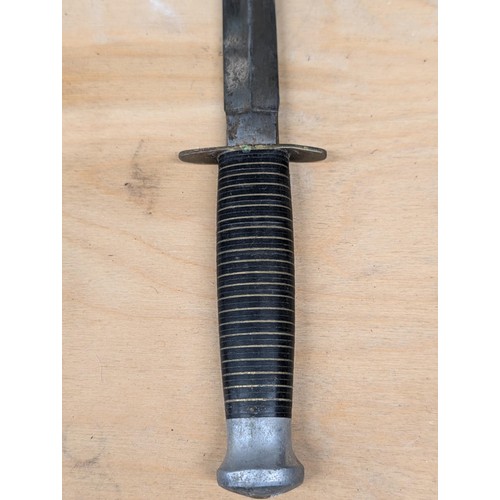 151 - WWII British Commando fighting knife in sheath