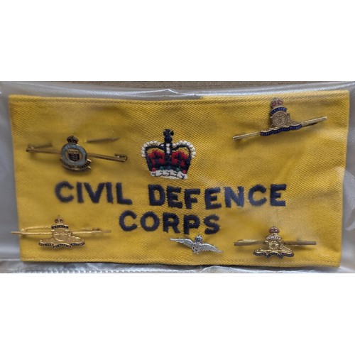 9 - Civil Defence Corps arm band with 5 x assorted military pin badges