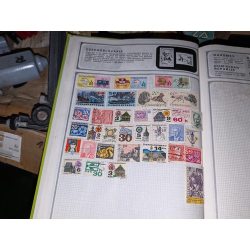 139 - Safari stamp album with stamps