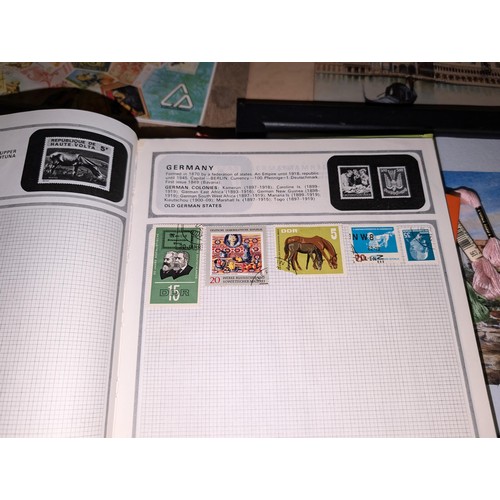 139 - Safari stamp album with stamps