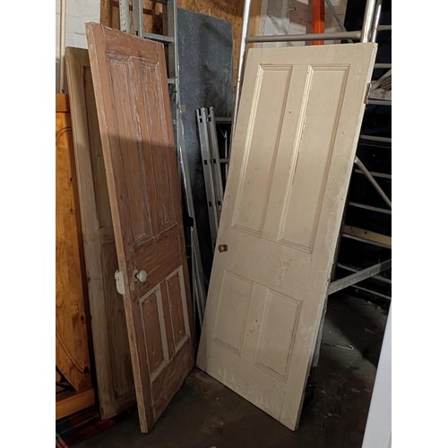 583 - Pair of pitch pine and 2 x 4 panel inside doors