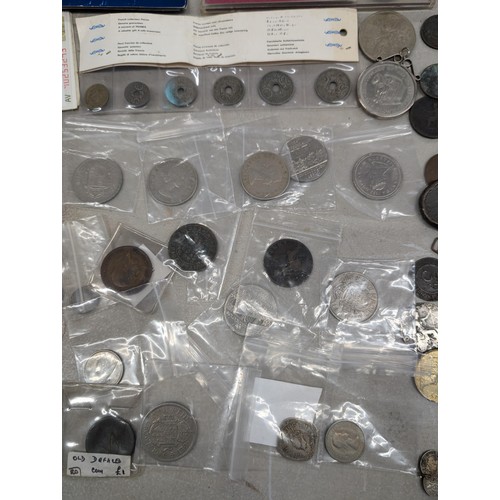 131 - Bundle of assorted mixed UK and international silver and copper coinage, notes and crowns