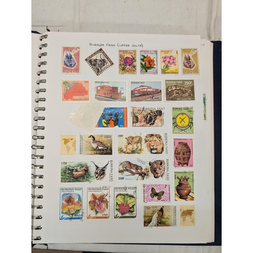 35 - Folder of modern stamps, Stanley Gibbons stamp catalogue and 2 x sheets of WWII christmas greeting a... 