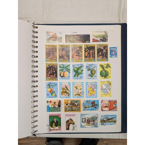 35 - Folder of modern stamps, Stanley Gibbons stamp catalogue and 2 x sheets of WWII christmas greeting a... 