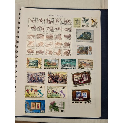 35 - Folder of modern stamps, Stanley Gibbons stamp catalogue and 2 x sheets of WWII christmas greeting a... 