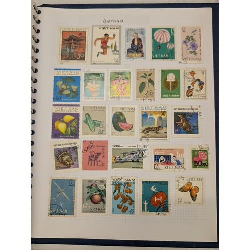 35 - Folder of modern stamps, Stanley Gibbons stamp catalogue and 2 x sheets of WWII christmas greeting a... 