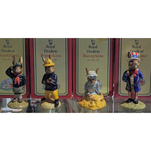 84 - 4 x boxed and mint Royal Doulton Bunnykins figures being Be Prepared, Fireman, Seaside & Uncle Sam